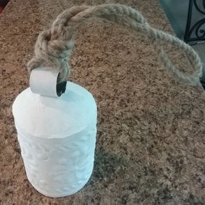 Metal bell embossed flowers jute rope